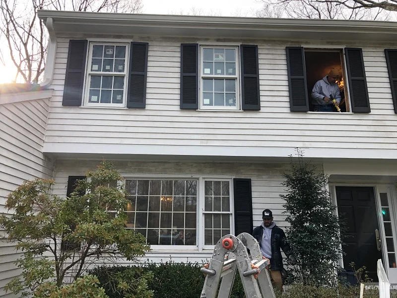 Andersen windows being installed in a Wilton, CT colonial home
